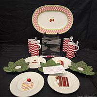 Group shot showing entire lot: platter, mugs, dessert plates, candle holders