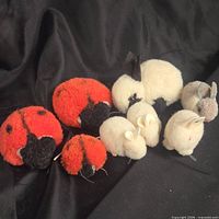Group shot of six pompom animals showing scale, colors and condition