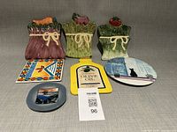 Seven ceramic kitchen pieces displayed front and back rows