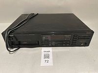 Front view showing display, controls and empty magazine slot