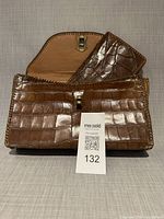 Purse front open showing scales and wallet inside