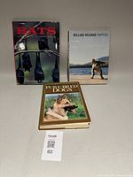 Overall view of the three animal-theme books in the lot