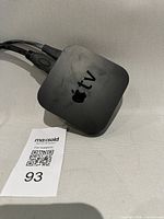 Top view of Apple TV box with logo