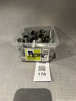 front view of clear bin filled with assorted sockets