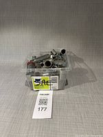 Plastic tub filled with assorted chrome sockets