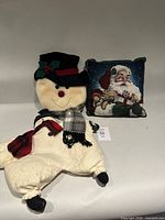 Group shot: Santa pillow and one snowman cushion
