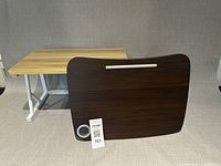 Light wood laminate stand and dark wood lap desk front view