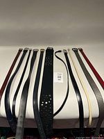 Full view of belts laid out showing variety