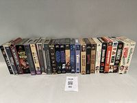 Front row of approximately half of the VHS tapes showing spine titles
