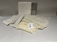 Packaged Ikea BRITT curtain set and folded loose sheer panels