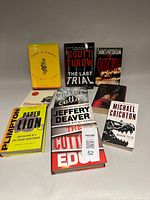 Group shot of all nine books front covers visible