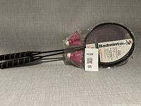Full view of packaged badminton set showing two rackets and two shuttlecocks