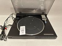Top view of Sony PS-LX510 turntable with lid open showing platter, tonearm, cables, and control panel