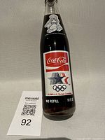 Front view showing main label, Olympic rings and capacity