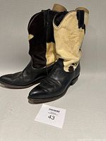 Boots angled front view showing leather foot and hair-on shaft