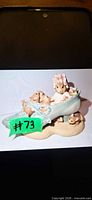 Front view of Beatrix Potter BP71 figurine with mother mouse and baby mice in blue shoe