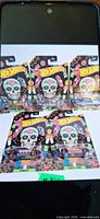 Five packaged Hot Wheels Halloween cars laid out