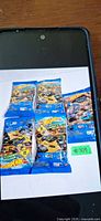 Five sealed Hot Wheels Mystery Models blind-bag packs displayed on white background