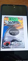 Front view of sealed Hot Wheels Racing Michigan Speedway car in original card