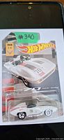 Front view of sealed Hot Wheels 1959 Corvette Stingray die-cast car on card backing