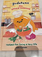 Front cover of the cookbook showing title, character illustration, author