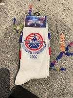 White Top Gun Volleyball Tournament 1986 crew sock in retail packaging