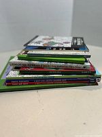 Side view of stacked adult colouring books showing titles and spines
