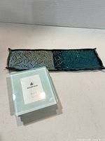 Boxed Bowring glass coasters and handmade ceramic leaf-pattern dish shown together