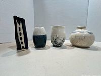 Four vases front view showing shapes and glazes