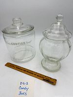 Both candy jars with lids shown beside ruler for scale
