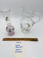 Bud vase and pitcher side by side with ruler for scale