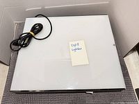 Top view of light box showing translucent work surface and attached power cord