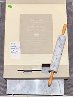 Box for Sur La Table white marble pastry board with rolling pin placed on top