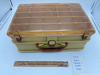 Closed case front view showing latch and translucent lid