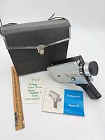 Camera, case, manual together for overview