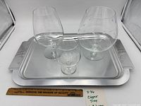 Full lot view showing tray and three snifters with ruler for scale