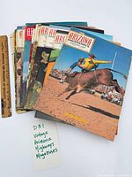 Stack of 17 Arizona Highways magazines with ruler for scale