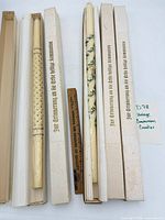 All five boxed communion candles displayed with ruler for scale