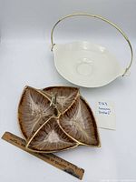 Overall view of both serving dishes with ruler for scale