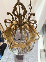 Top view showing ornate brass crown and hanging hardware