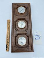 Front view showing three gauges and ruler for size reference