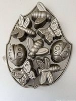 Leaf-shaped Backyard Bugs cakelet pan displaying insect cavities
