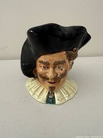 Front view showing Cavalier face, hat and collar