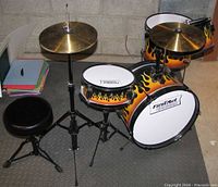 Full view of assembled junior drum set with stool and cymbal
