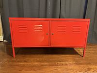 Front view showing two vented doors and legs