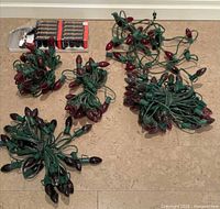 Bundles of green-wire C9 light strands with mixed bulbs and packaged replacement bulbs