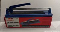Tile cutter in retail box showing brand and model