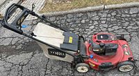 Overall view of Toro mower left side with bag attached