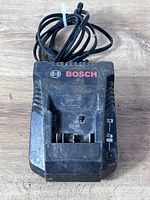Top view of Bosch battery charger showing logo and slot for battery