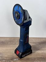 Full view of Bosch cordless angle grinder standing upright